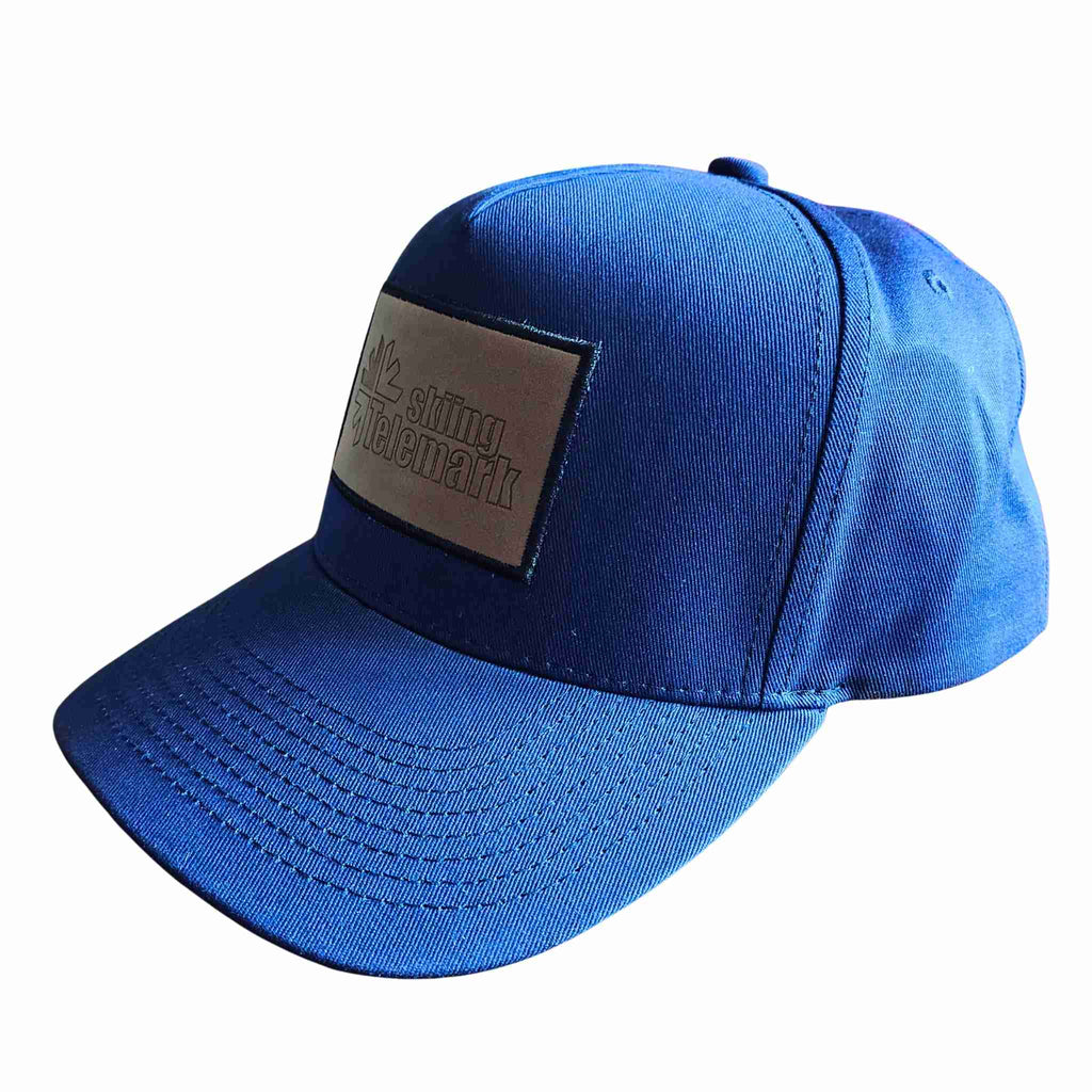 Baseball cap Telemark skiing logo left blue without model